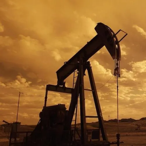 Oil pump jack at sunset